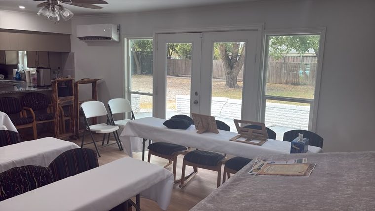 Main room set with tables and shtenders, overlooking the garden